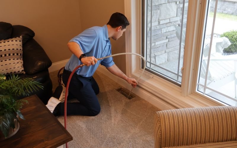 a man holding a hose