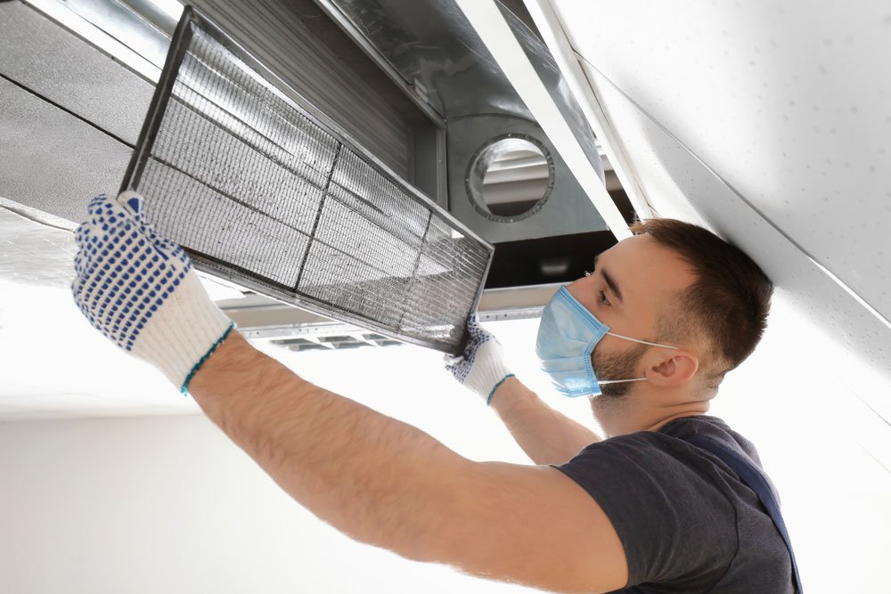 man doing Residentian air duct cleaning