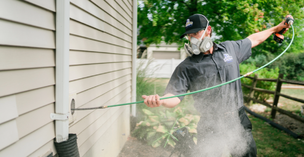 Vent cleaning greenwich CT man cleaning the vent outside the house
